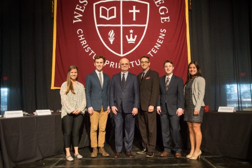 Students and Professor Don Patterson pose with Gen. Hayden at convocation on campus