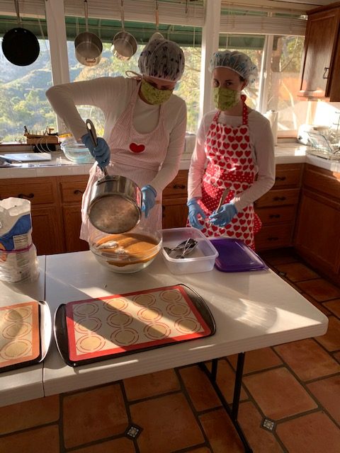 Twin daughters, Emily and Kate, enjoy baking