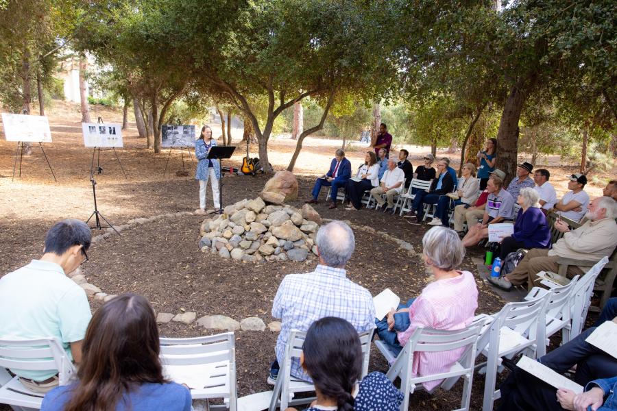 woman speaking at potters clay event