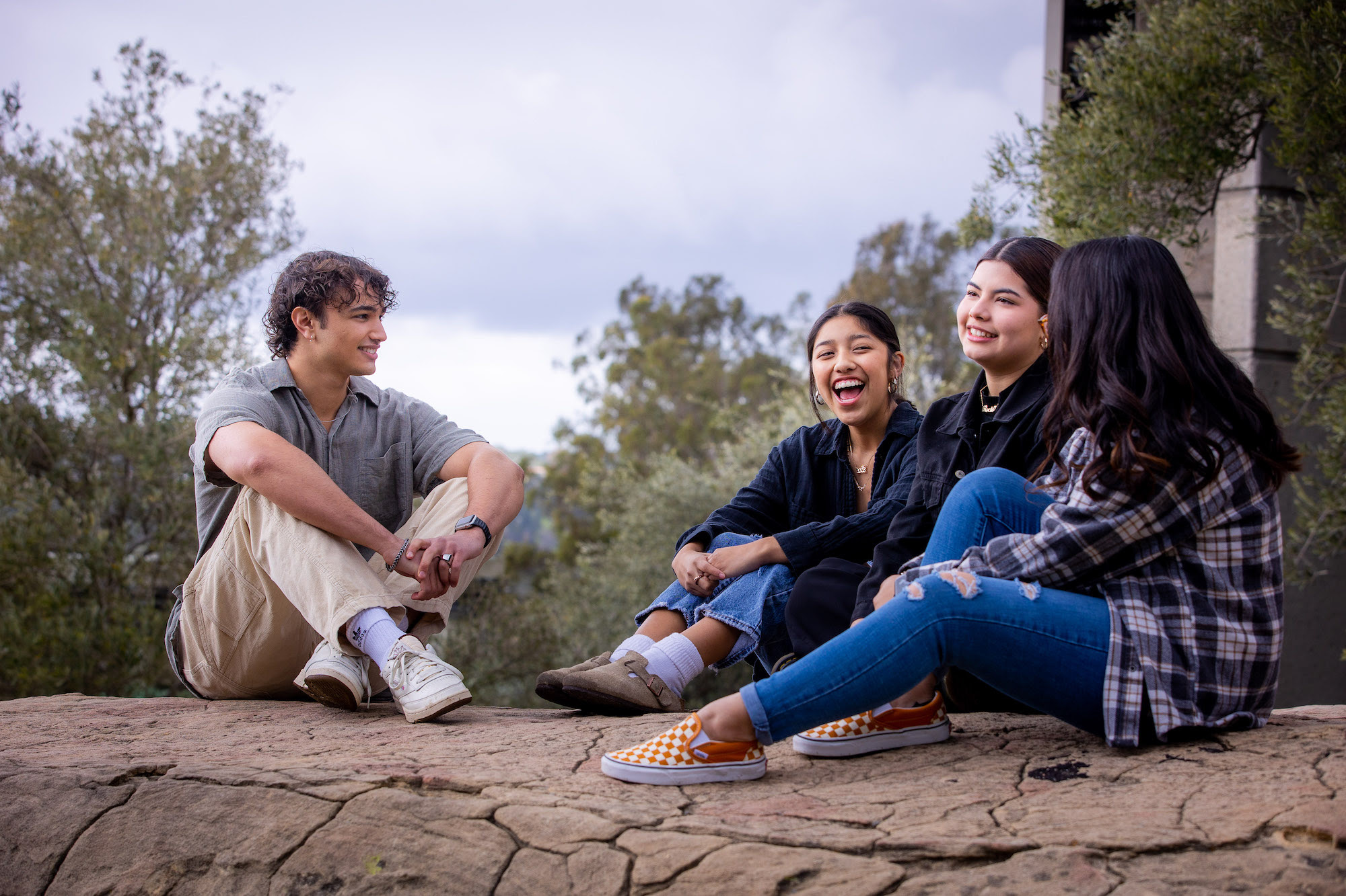 westmont students sitting on the rock